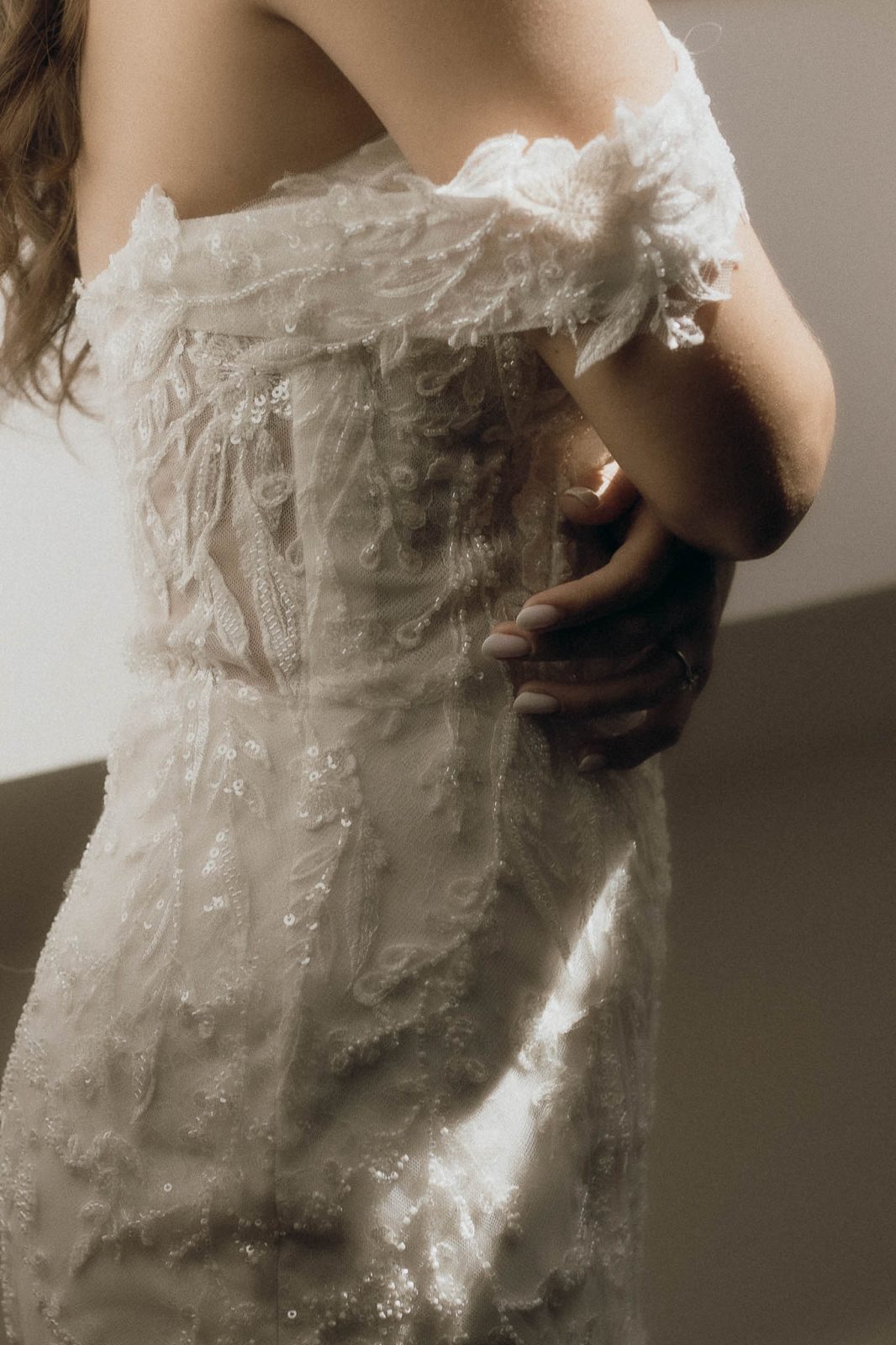 detail photo of bride with a beaded statement bodice