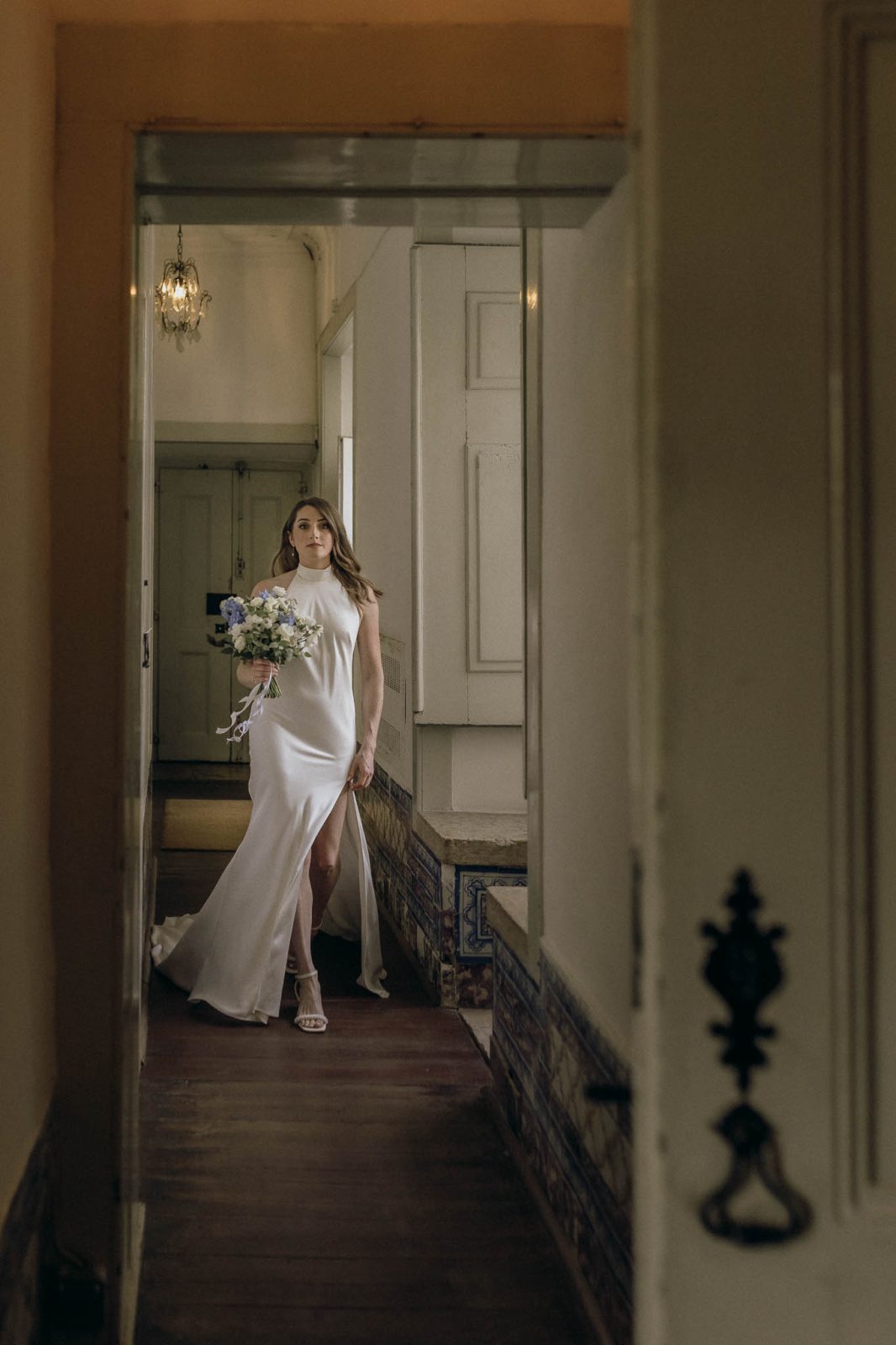 bride wtih sheath dress walking elegantly