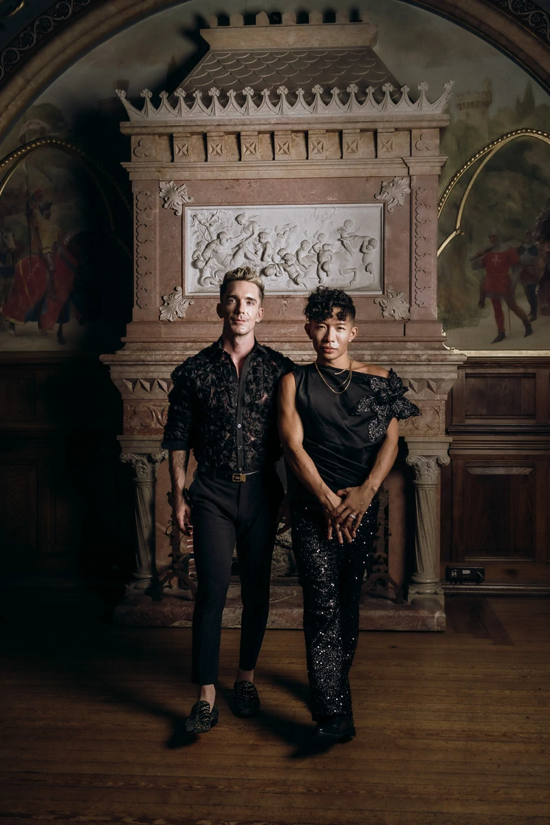 stylish photo of gay couple with second outfits at forte da cruz